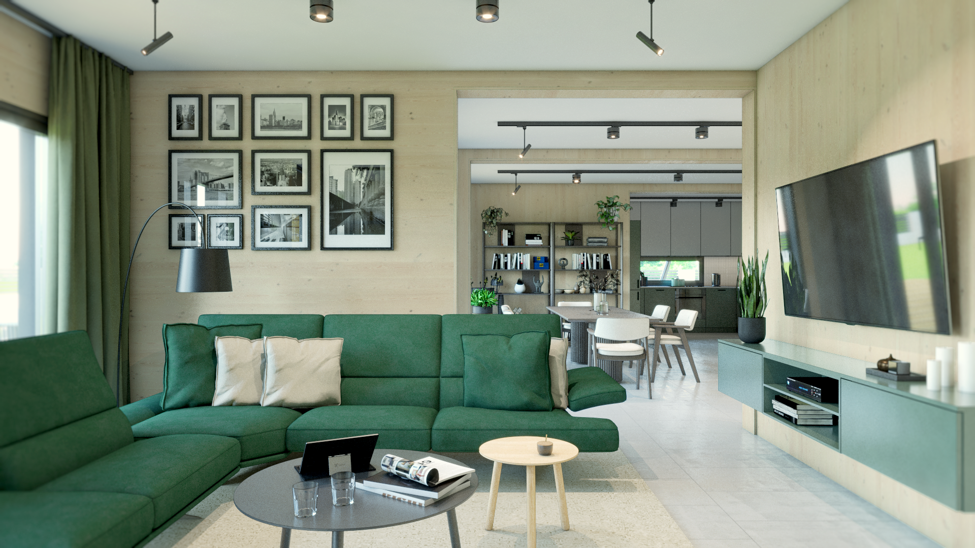Modulhaus Vennlig Wohnzimmer. Großer Raum mit viel Platz. Im Wohnzimmer steht ein grüner Couch in L Form. Gegenüber ist ein Fernseher an der Wand. Hinten sieht man ein Esszimmer und moderne Küche.